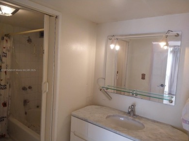 GATED 1 BDR 1.5 BATH TILED UNIT WITH WATER VIEW. 1 BLOCK TO