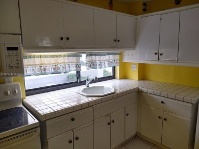 GATED 1 BDR 1.5 BATH TILED UNIT WITH WATER VIEW. 1 BLOCK TO