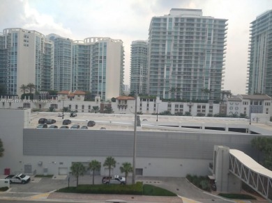 GATED 1 BDR 1.5 BATH TILED UNIT WITH WATER VIEW. 1 BLOCK TO