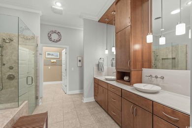 This all-brick custom-built home in the gated community of