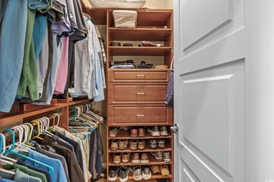 This all-brick custom-built home in the gated community of