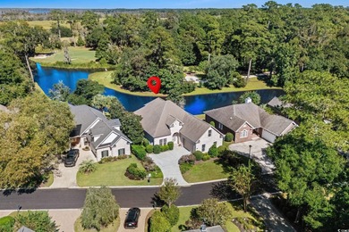 This all-brick custom-built home in the gated community of