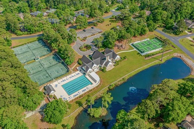 This all-brick custom-built home in the gated community of