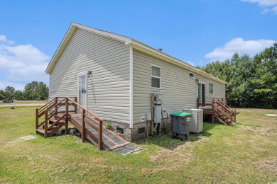 No HOA! This 3-bedroom, 2-bath home sits on over an acre of land