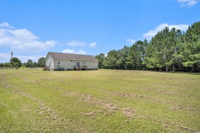 No HOA! This 3-bedroom, 2-bath home sits on over an acre of land