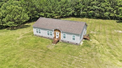 No HOA! This 3-bedroom, 2-bath home sits on over an acre of land