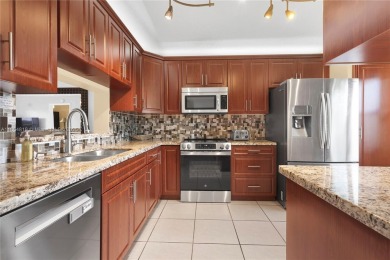 Welcome home! This 2-bedroom, 2-bathroom, first floor condo with