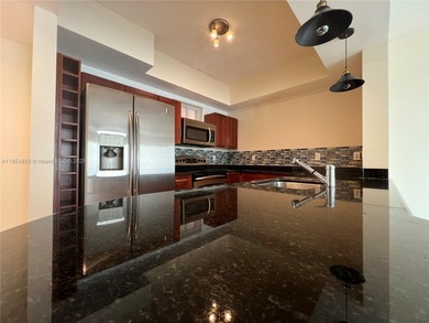 This spacious residence offers an open-concept living and dining