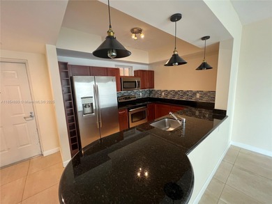 This spacious residence offers an open-concept living and dining