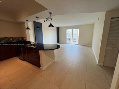 This spacious residence offers an open-concept living and dining