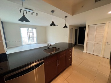 This spacious residence offers an open-concept living and dining