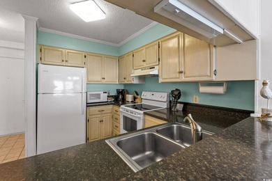 Discover this charming 2-bedroom, 2-bath condo in the highly