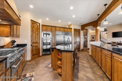 Tucked at the end of a private cul-de-sac, this exquisite estate