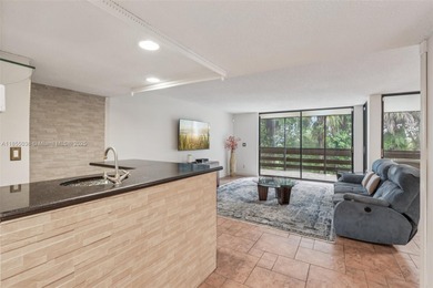 Welcome to this beautifully maintained two-story condo in