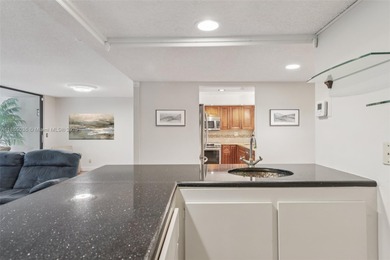 Welcome to this beautifully maintained two-story condo in