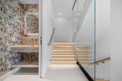 Experience luxury coastal living in this fully renovated 3-story