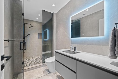 Experience luxury coastal living in this fully renovated 3-story