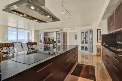 Rarely available direct ocean corner residence offering 3
