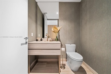 Experience refined oceanfront living in Residence 401 at the