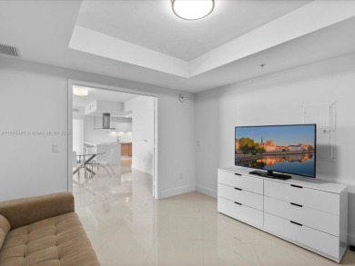 Discover waterfront luxury in this spacious 2-bedroom + den