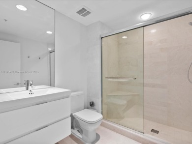 Discover waterfront luxury in this spacious 2-bedroom + den