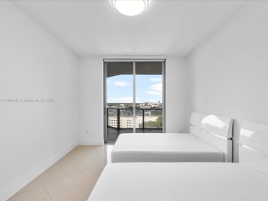 Discover waterfront luxury in this spacious 2-bedroom + den