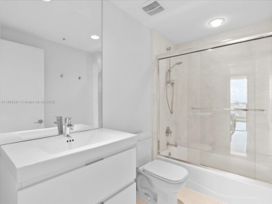 Discover waterfront luxury in this spacious 2-bedroom + den