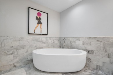 Experience modern elegance in this 4-bedroom, 3-bath condo with