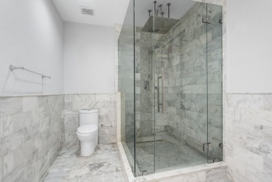 Experience modern elegance in this 4-bedroom, 3-bath condo with