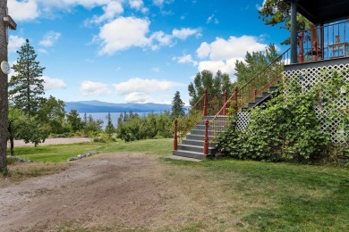 Perched on 20 acres overlooking Flathead Lake, this exceptional