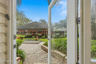 Nestled beneath a canopy of Mandarin oak trees, this