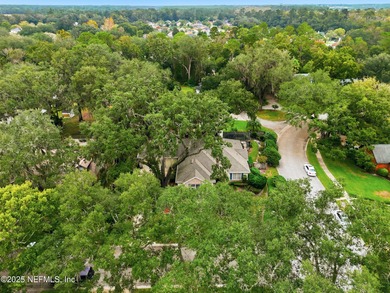 Nestled beneath a canopy of Mandarin oak trees, this