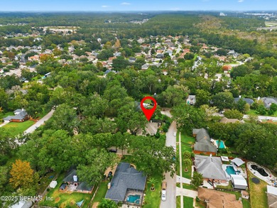 Nestled beneath a canopy of Mandarin oak trees, this