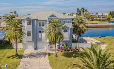 Experience enhanced waterfront living in this custom-built 3,208
