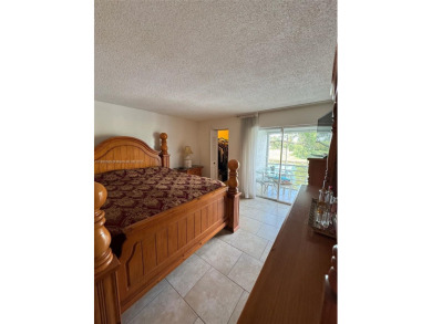 Serene living room and the bedroom in this spacious 2nd-floor