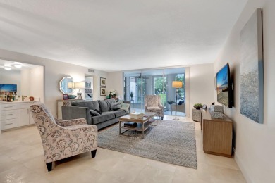 Enjoy the Florida lifestyle in this gorgeous 1st-floor condo in