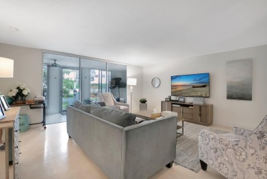 Enjoy the Florida lifestyle in this gorgeous 1st-floor condo in