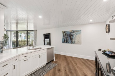 GORGEOUS TOTALLY REMODELED 1 BEDROOM 1 1/2 BATH 1ST FLOOR UNIT