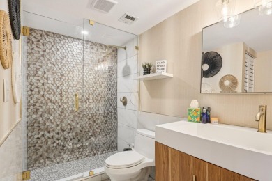 GORGEOUS TOTALLY REMODELED 1 BEDROOM 1 1/2 BATH 1ST FLOOR UNIT