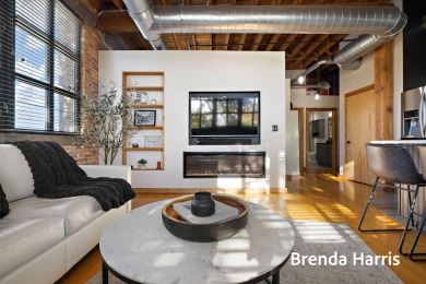 Welcome to this stunning top-floor southwest corner loft-one of