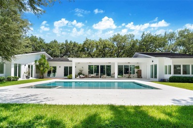 Set on a rare, oversized 56,192 SF lot in one of Coral Gables'