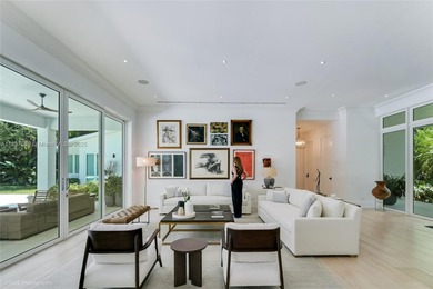 Set on a rare, oversized 56,192 SF lot in one of Coral Gables'
