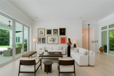 Set on a rare, oversized 56,192 SF lot in one of Coral Gables'
