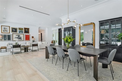 Set on a rare, oversized 56,192 SF lot in one of Coral Gables'