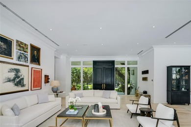 Set on a rare, oversized 56,192 SF lot in one of Coral Gables'