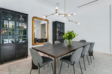 Set on a rare, oversized 56,192 SF lot in one of Coral Gables'