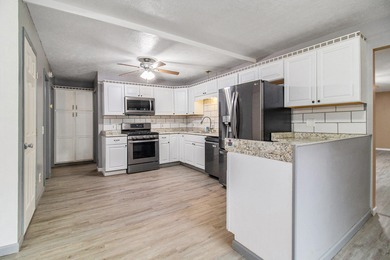 This 5-bedroom, 3-bath home is just moments away from Long Lake