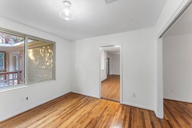 Solid brick 4-bed/2-bath with a flexible nine-room layout-living