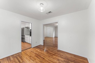 Solid brick 4-bed/2-bath with a flexible nine-room layout-living