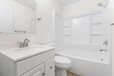 Solid brick 4-bed/2-bath with a flexible nine-room layout-living